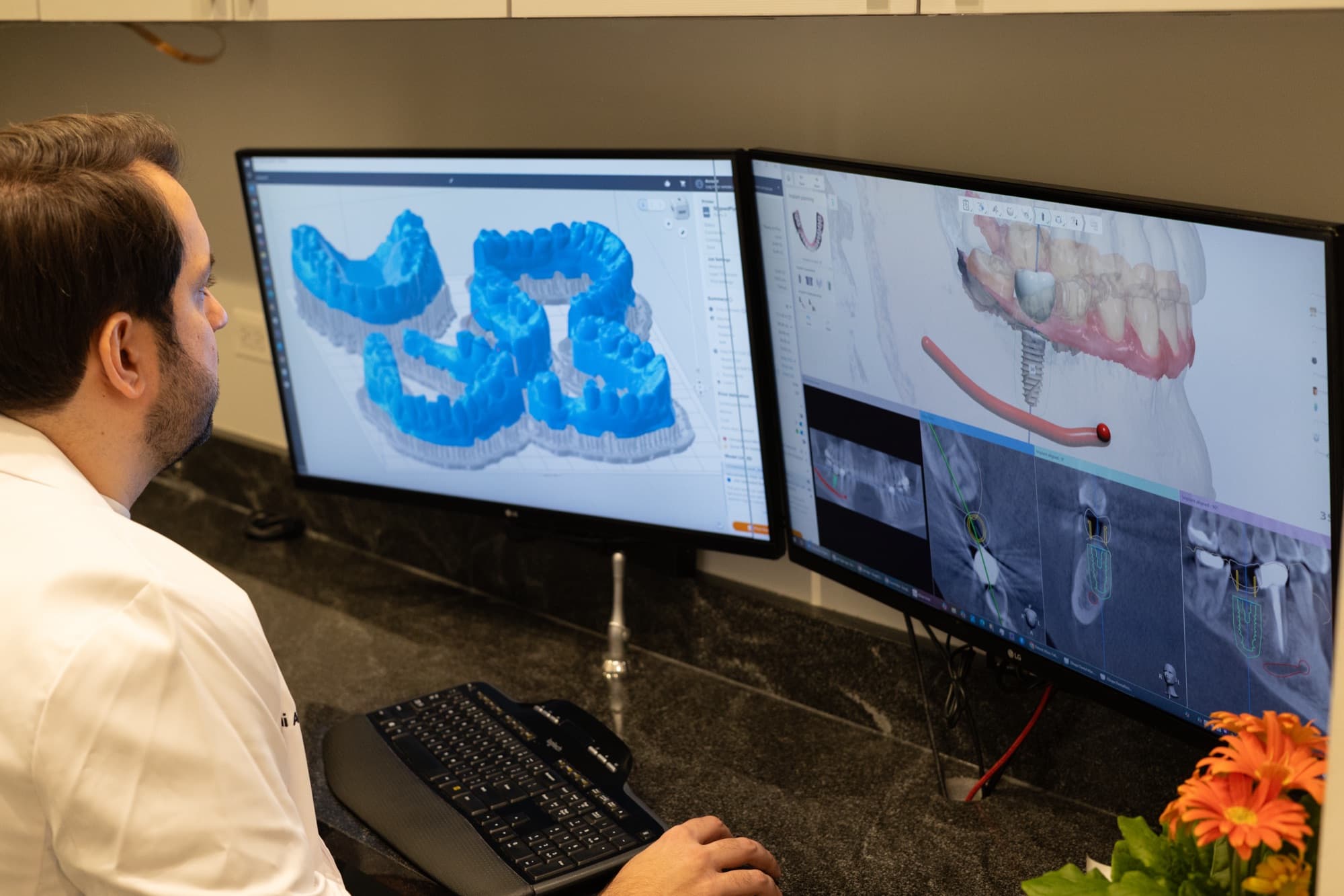 Dr. Atassi planning a case across two monitors