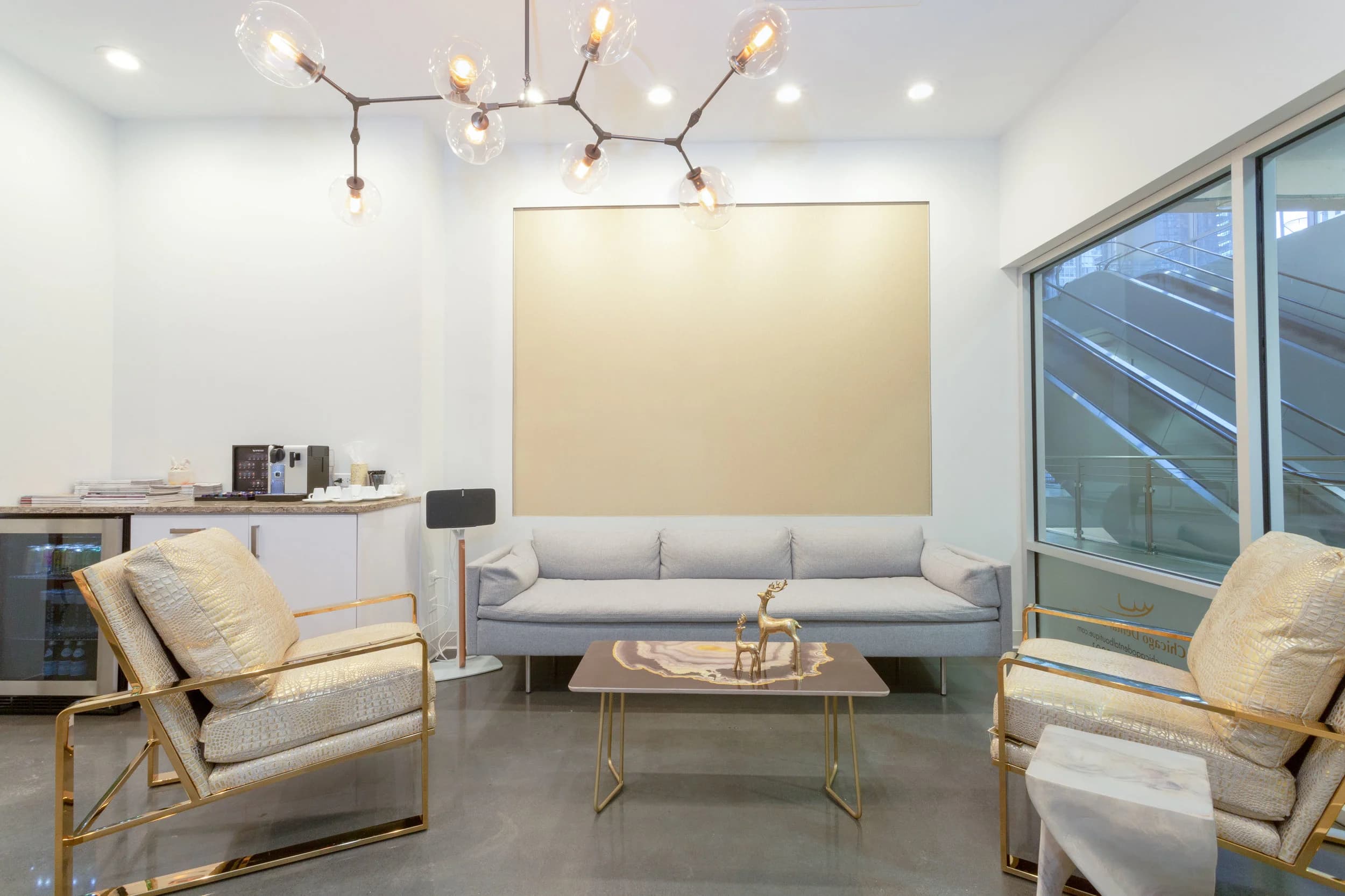 The lounge: sofa, armchairs and the branch chandelier